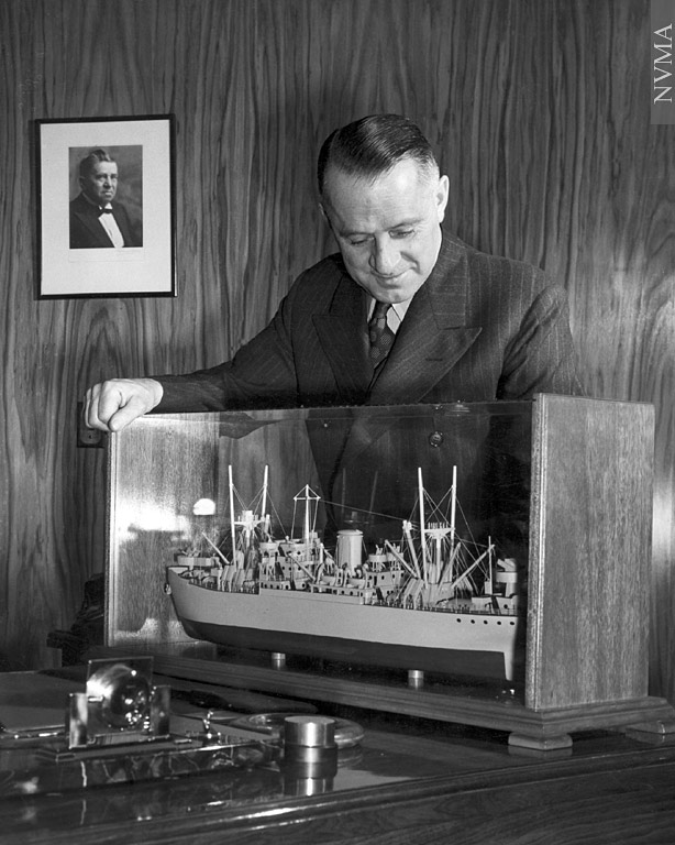 Clarence Wallace with model of a cargo ship in 1943. (Photo Credit: North Vancouver Museum Association)